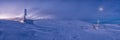 Winter sunset snow field on top of mountain under colorful sky.