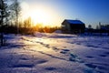 Winter sunset village in cold evening. Russian winter.