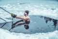 Winter swimming. Man in an ice-hole. Royalty Free Stock Photo