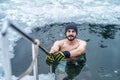 Winter swimming. Man in an ice-hole. Royalty Free Stock Photo