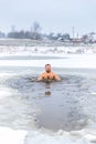 Winter swimming. Man in ice-hole Royalty Free Stock Photo