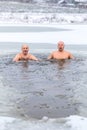 Winter swimming. Man in ice-hole Royalty Free Stock Photo