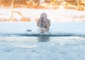 Winter swimming. Man to an ice-hole Royalty Free Stock Photo