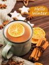 Winter theme. Cup of hot tea with spices, orange, cinnamon, anis