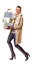 Fashion-monger on white with pile of Christmas giftes walking Royalty Free Stock Photo