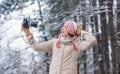 Winter time fun. happy woman make selfie on camera. winter selfie. having fun snowy forest. cold weather brings good Royalty Free Stock Photo