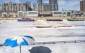 Winter time in  the marina of Montreal Old Port with Beach umbrella  boats before condos Royalty Free Stock Photo