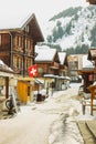 Winter time in Murren, Switzerland with streets covered with snow and ice. Beautiful houses Royalty Free Stock Photo