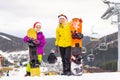 Winter time and skiing - family with ski and snowboard on ski ha Royalty Free Stock Photo