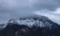 Winter time snowy lonely mountain peak gorgeous picturesque moody and foggy scenic view landscape background