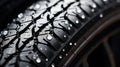 winter tire, friction for snow and ice. asymmetrical tread pattern. close-up on a black background. Royalty Free Stock Photo