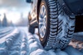 Winter tire grip close up of car tires on a snowy road