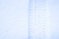 Winter tire track on a snow surface. Royalty Free Stock Photo