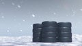 Winter tires on a background of snowstorm, snowfall and slippery winter road. Winter tires concept. Concept tyres Royalty Free Stock Photo