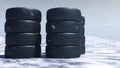 Winter tires on a background of snowstorm, snowfall and slippery winter road. Winter tires concept. Concept tyres Royalty Free Stock Photo