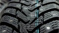 Winter tires for the car. Radial tread, thin lamellas and metal spikes Royalty Free Stock Photo