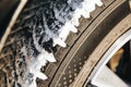 Winter tires covered with snow, close-up. Selective focus. Royalty Free Stock Photo