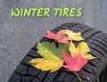 Tires with text winter tires and autumn leaves