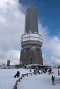 Winter tourists in front of the telecommunications tower Feldberg, Hesse, Germany