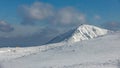 Winter trail leading to the edge of the mountain to the summit of Snezka from the Polish side of the mountain. Snezka hill with Ob Royalty Free Stock Photo