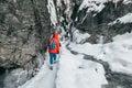 Winter traveler in snow mountain canyon