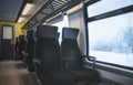 Train interior and winter window view Royalty Free Stock Photo