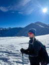 Winter trekker pausing in the serene expanse of the Polish Tatras