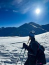 Winter trekker pausing in the serene expanse of the Polish Tatras