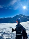 Winter trekker pausing in the serene expanse of the Polish Tatras