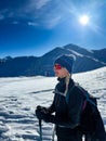 Winter trekker pausing in the serene expanse of the Polish Tatras