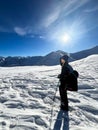 Winter trekker pausing in the serene expanse of the Polish Tatras