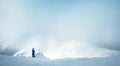 Winter Trekker staying on mountain peak he climbed and enjojing wide panorame view of valley covered by storm clouds. Active