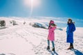 Winter, two girls having fun in the snow in the mountains Royalty Free Stock Photo