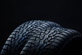 Winter tyres on black background with contrasty lighting Royalty Free Stock Photo