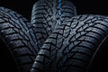 Winter tyres on black background with contrasty lighting Royalty Free Stock Photo