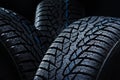 Winter tyres on black background with contrasty lighting Royalty Free Stock Photo