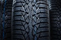 Winter tyres on black background with contrasty lighting Royalty Free Stock Photo