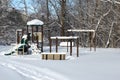 Winter urban city landscape - a snow-covered playground in a residential area in Canada