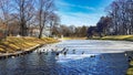 A winter view along a frozen Riga canal with a flock of wild ducks Royalty Free Stock Photo