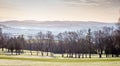 Winter view of golf course with hills in the distance. Werneth Low Country Park on the borders of Stockport and Tameside,  Greater Royalty Free Stock Photo