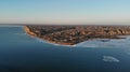 Winter view of little city on clay hills near the Dnieper estuary. The water is partially covered with ice. Stanislav. Royalty Free Stock Photo