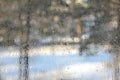 Winter view through misted over glass. Royalty Free Stock Photo