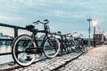 Winter view of parked bicycles alongside the Dutch river Maas