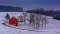 Winter view of a red barn on a farm in rural York County, Pennsylvania. Royalty Free Stock Photo