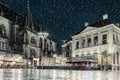 Winter view with snowfall of the Dutch central square in the cit Royalty Free Stock Photo