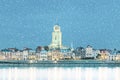 Winter view with snowfall of the Dutch city of Deventer in Overijssel with the river IJssel in front Royalty Free Stock Photo