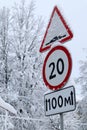 Winter view of speed limit sign on the road covered by snow