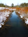 Snowy view of winter stream in FingerLakes nature preserve Royalty Free Stock Photo