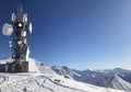 Winter view of transmitters on a sunny day, around the traces of people, on Mount Georgia Gudauri