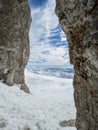 Winter views of the fascinating mountain range from the entrance of a cave in the peak mountains Royalty Free Stock Photo
